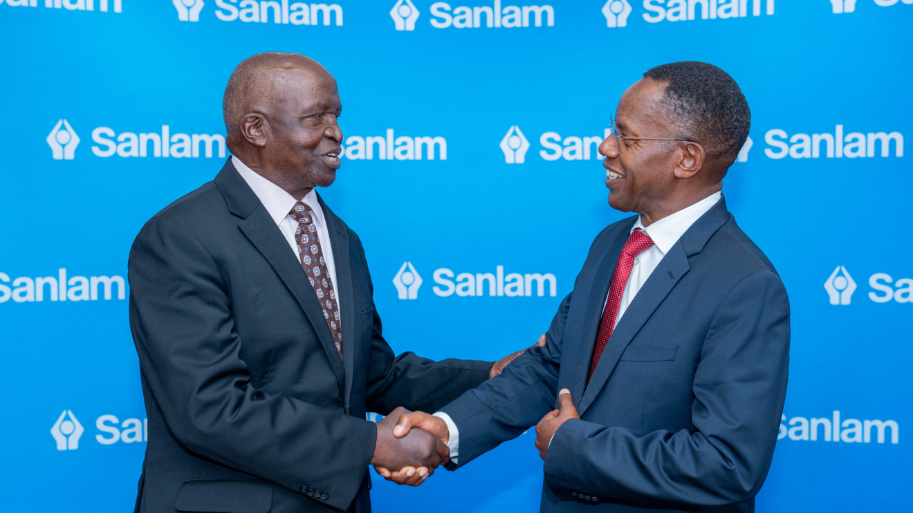 Sanlam Kenya PLC Chairman Dr John Simba (left) shares a light moment with the company's Group CEO Dr Patrick Tumbo. PHOTO/COURTESY